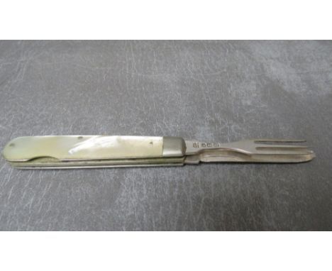 A HALLMARKED SILVER COMBINATION FOLDING KINFE AND FORK, with mother of pearl handle