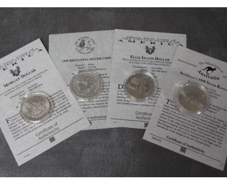 USA 1896 MORGAN DOLLAR, 1986 ELLIS ISLAND DOLLAR, Australia 1998 silver 1oz kangaroo dollar and UK 1999 silver 1oz Britannia,