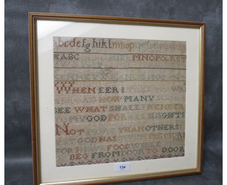 A 19TH CENTURY ALPHABET SAMPLER, framed and glazed, 30 x 33 cm