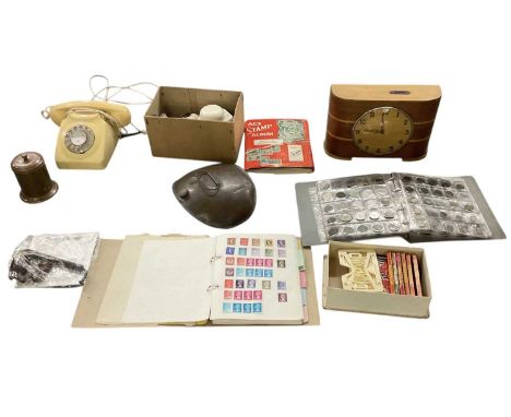A group of mixed collectables including an album of British and world vintage coins, with some silver examples, a folder and 