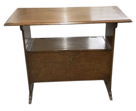 A 1920s oak monk's bench, with hinged seat, top 92 x 48cm.