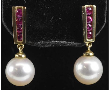 Standard VAT A pair of 9ct yellow gold ruby and cultured pearl drop earrings, length 20mm, combined approx 2.1g.PLEASE NOTE: 
