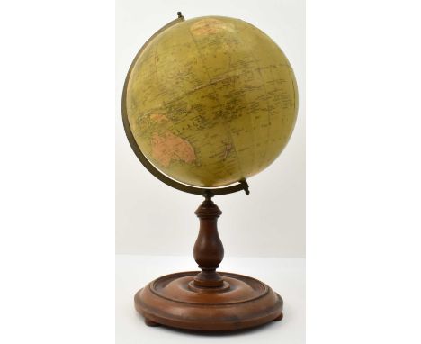 A late 19th/early 20th century Philip's 9" terrestrial globe, on bronze frame, turned wooden column and dish shaped base, hei
