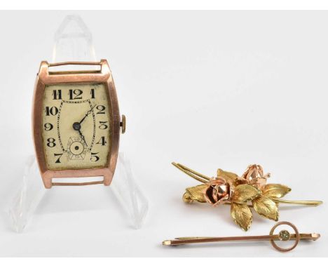 Two 9ct gold brooches, one of floral style with rose gold flower heads, length 4.7cm, a single bar brooch with tiny bezel set