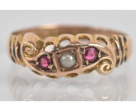 Standard VAT An antique 9ct rose gold ruby and pearl three stone ring, size J 1/2, approx 1.1g.PLEASE NOTE: VAT is payable on
