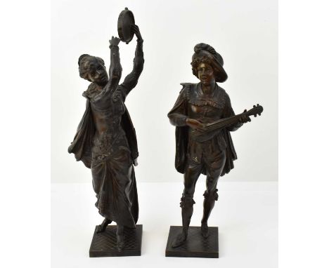 A pair of late 19th/early 20th century cast bronze figures of musicians, comprising a lady with tambourine and a gentleman wi