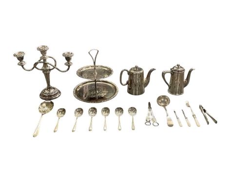 A small quantity of silver plated items including two teapots, three branch candelabrum, two tier cake stand, flatware, etc.