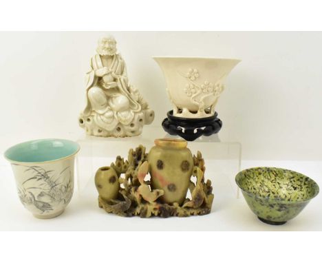 Five Oriental cabinet collectables comprising a reconstituted jade style cup with turned foot rim, height 5cm, diameter 10cm,