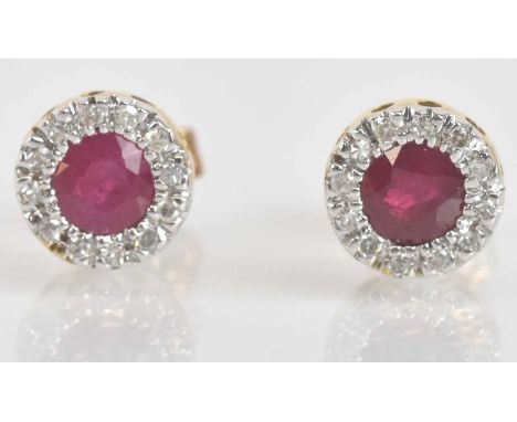 Standard VAT A pair of 9ct yellow and white gold ruby and diamond earrings, the circular platform 6.8mm, combined approx 1g.P