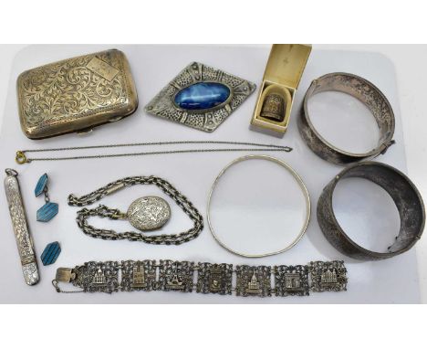 A quantity of small silver items comprising a cigarette case, a lozenge shaped brooch with a Ruskin style oval centre, length