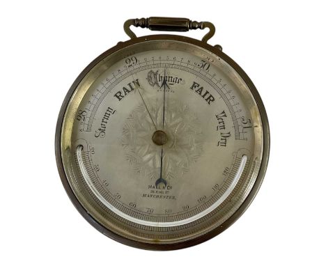 HALL &amp; CO, 56 KING STREET, MANCHESTER; an early 20th century brass cased circular wall hanging barometer, the dial inscri