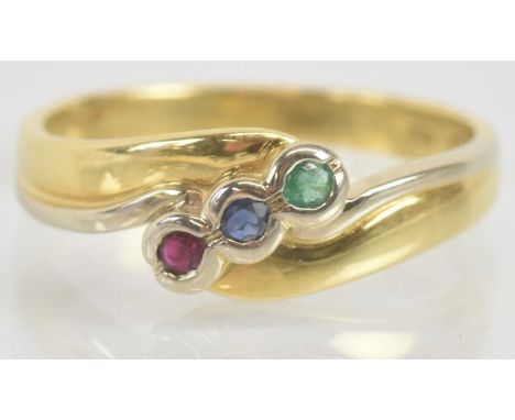 Standard VAT An 18ct yellow gold ruby, sapphire and emerald three stone ring set in swept crossover design, size N, approx 3.