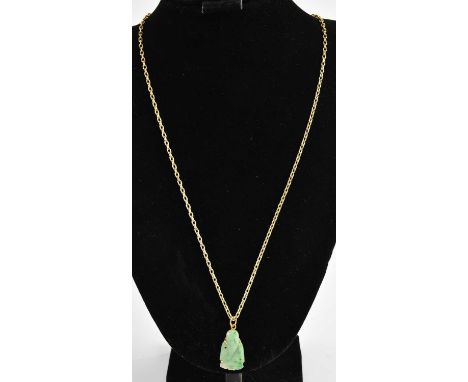 A small carved jade Buddha necklace pendant in gold mount, length 3cm, suspended on a 9ct gold necklace chain with lobster cl