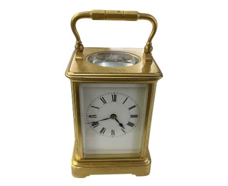 ROYAL INTEREST; a late 19th/early 20th century French brass cased carriage clock, the white enamel dial set with Roman numera