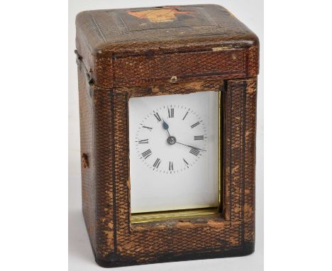 An early 20th century brass cased carriage clock, the white enamel dial set with Roman numerals and subsidiary seconds, (lack