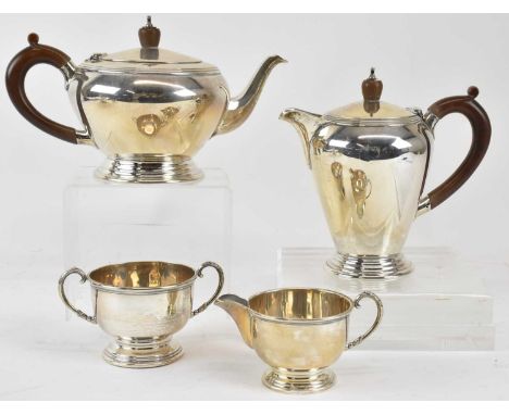 WAKELY &amp; WHEELER; a George VI hallmarked silver four piece tea service comprising teapot, coffee pot, twin handled sugar 