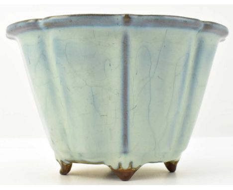 A Jun-style planter, possibly 19th century, crackle glazed in the Song dynasty Jun ware style, bears a no. 4 size mark to bas