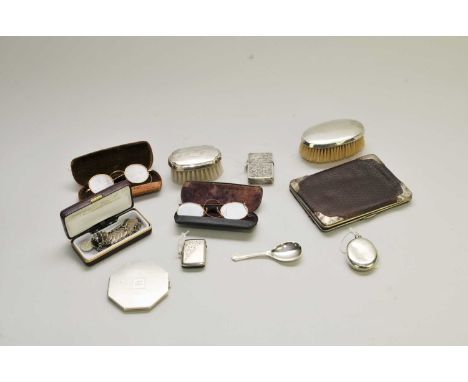 A silver mounted wallet, London 1900, together with two silver backed brushes, a silver vesta case, a white metal locket stam