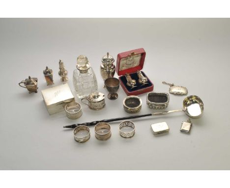 A cased pair of silver pepperettes, together with two further silver pepperettes, a silver sugar caster, two silver mustard p