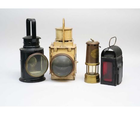 Three various railway lanterns, the largest with a cream painted finish, 35cm high, 14 x 21 cm, together with a Welsh miner's
