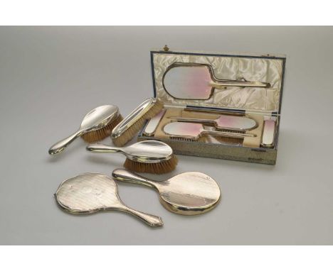 A cased silver and guilloche enamel dressing table set, Albert Carter, Birmingham 1938, comprising; a mirror, two hair brushe