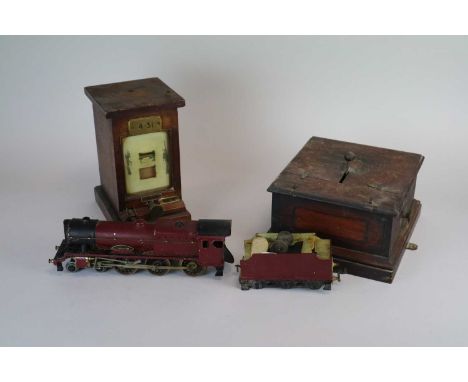 A mahogany cased Railway station signal lamp, together with a similar case and a scratch-built model locomotive, 'Royal Scot'