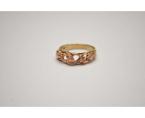 A 9ct Clogau gold ring, the yellow gold band mounted with rose gold leaf and berry motif, ring size V 1/2, weight approx 4.6g