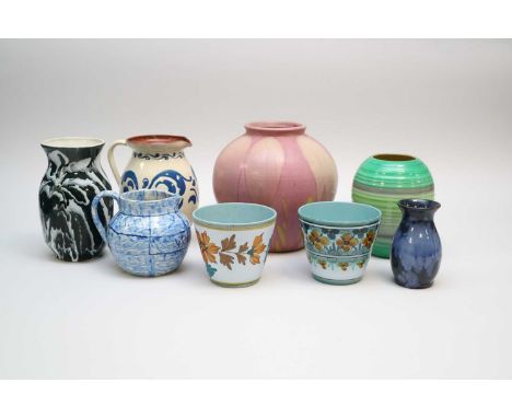 A collection of art pottery including an Art Deco Shelley banded vase, a Salopian Art pottery jug, E Radford jug, two Gouda p