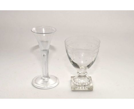 A reproduction wine glass in the 18th-century style, with teardrop to stem and a conical folded foot, 16cm high; together wit