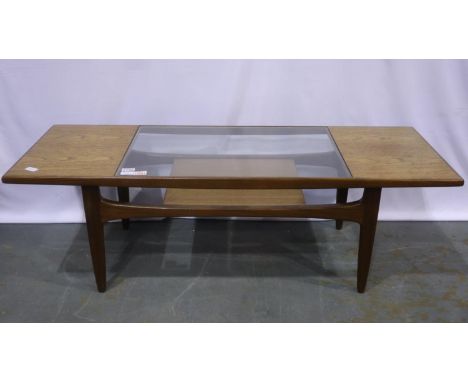 Norman Wilkins design for G Plan teak framed rectangular centre table with inset plate glass top and magazine shelf below, 13