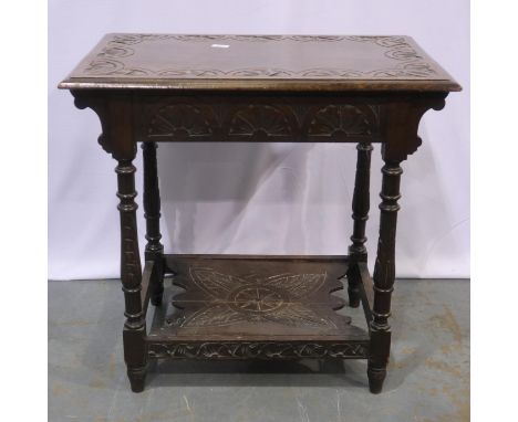 Early 20th century carved oak rectangular lamp table with turned supports and carved undershelf, 76 x 50 x 73 cm H, split to 