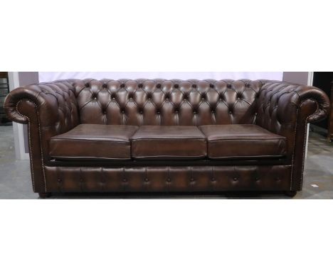 Modern brown leather three-seat Chesterfield sofa, of squared form with buttoned back, L: 195cm. Not available for in-house P