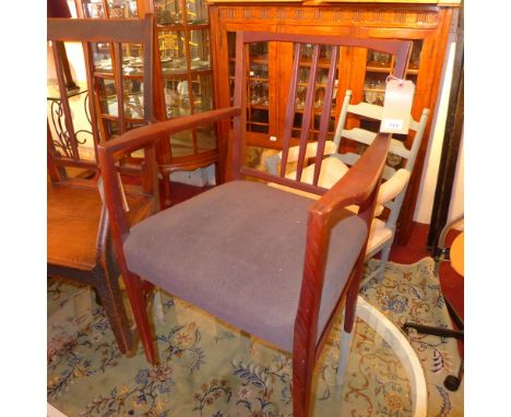 A Danish style stick back armchair with grey fabric pad seat 