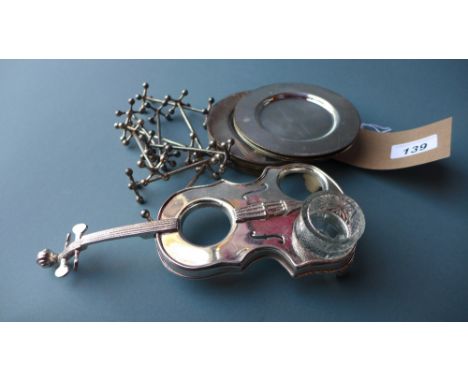 A pair of silver plated and glass condiment sets together with a set of silver plated dishes and knife rests 