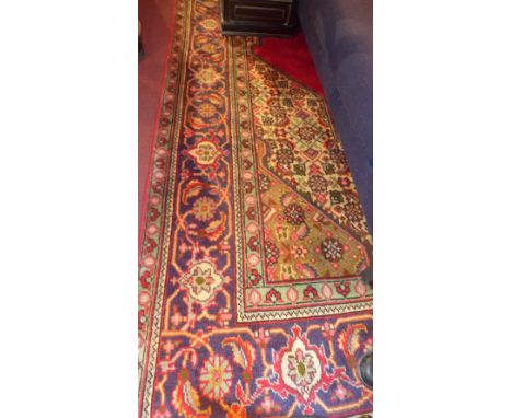 A fine north west Persian Tabriz carpet 350 x 250cm central diamond petal medallion on a rouge field within stylised floral s