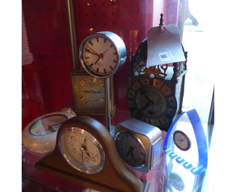 A brass lantern clock having Roman numerals to the dial together with a carriage clock and other clocks 