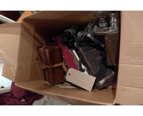 A collection of vintage cameras including Minolta, Olympus and others, with lenses 