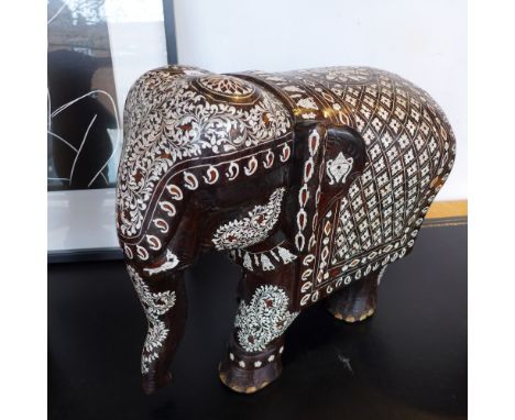 A mid 20th century Indian rosewood model of an elephant, inlaid with bone and other woods 
