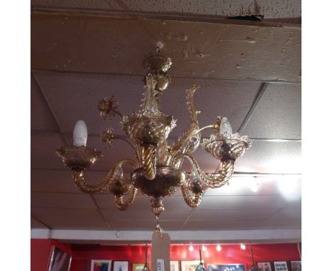 A Venetian Murano glass chandelier, hand blown, with leaf adornments