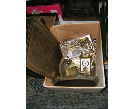 A quantity of brass including a large tray, clock, bells, bowl etc.
