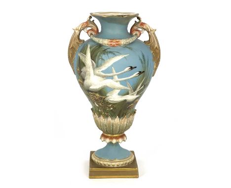 Charles Baldwyn for Royal Worcester, a twin handled vase,1899, double gourd pedestal urn form, acanthus moulded handles unite