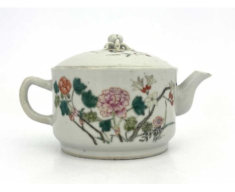 A Chinese famille rose teapot, squat cylindrical form, painted with peonies and flowering branches, the domed lid with peach 