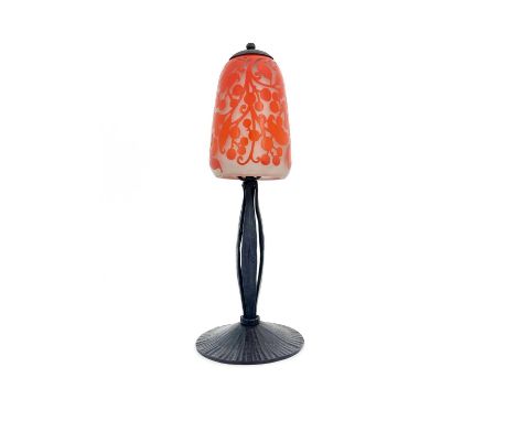 Daum, an Art Deco cameo engraved glass and wrought iron table lamp, circa 1925, the rounded conical shade cased with orange o