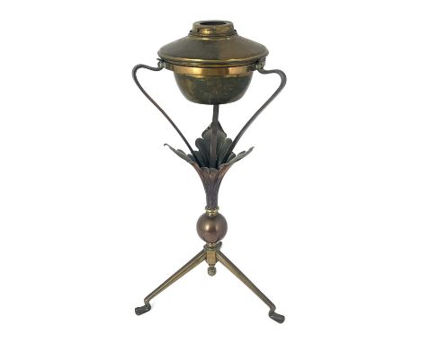 W A S Benson, an Arts and Crafts copper and brass oil lamp, model 114, circa 1900, the angled tripod base with pad feet suppo