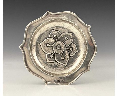 Keswick School Industrial Art, an Arts and Crafts silver pin dish, Chester 1908, ogee rimmed circular form, planished and emb
