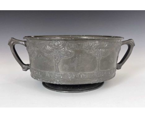 David Veasey for Liberty and Co., an Arts and Crafts Tudric pewter twin handled bowl, model 011, footed drum form, cast with 