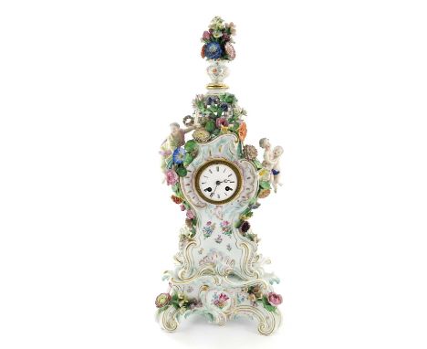 A Meissen bracket clock on stand, circa 1850, with floral encrused urn finial on reticulated domed above enamelled clock face