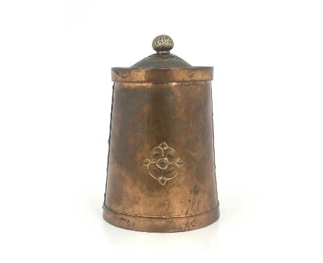 An Arts and Crafts copper tea canister, circa 1905, tapered cylindrical form, domed top with hammered brass finial, studded r
