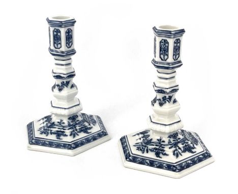 A pair of Meissen Onion pattern candlesticks, of 18th century taper stick form, octagonal knopped baluster stems, blue and wh