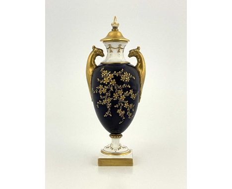 A Royal Worcester vase of neoclassical form, circa 1903, with twin bird's head handles, the foot and neck moulded with swags,